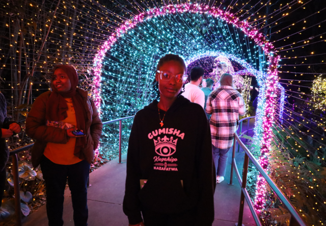 Youth Futures student standing outside of the Tunnel of Light at the Atlanta Botanical Garden.