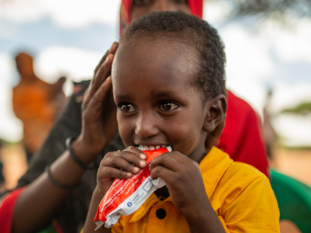A young child experiencing extreme hunger receives treatment from an IRC mobile health team in Olol village, Somalia.