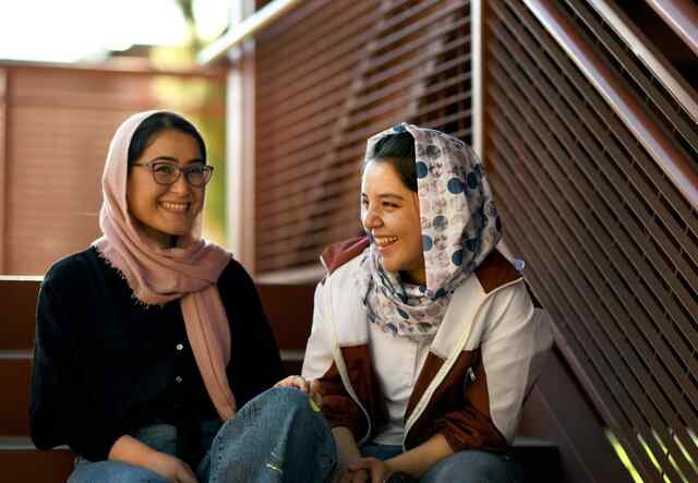 Zahra and Hadisa share a conversation on the campus of ASU.