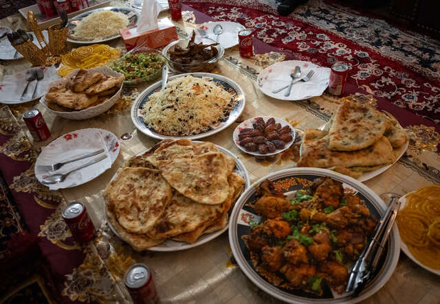 A spread of traditional Afghan food is pictured.