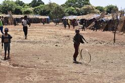 children playing in sandy village