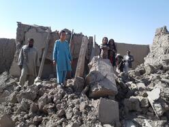 people on rubble