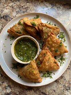 Sambusas around a plate