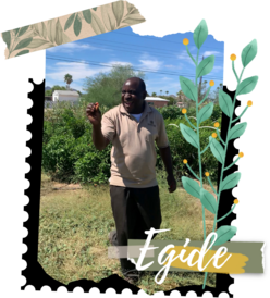 New Roots Farmer, Egide, showing off his produce.