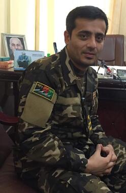 Maiwand sitting in an Afghan military uniform.