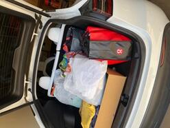 Car truck filled with clothes that will be donated to the Welcome Center for Asylum Seeking Families at the Welcome Center in Phoenix