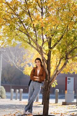 Rahila leaning against a tree at the ASU Tempe campus.