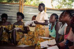 A group of girls writing.