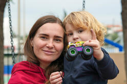 IRC client, Khrystyna, 32, with her son, Yaroslav, 4, in a park after picking up Yaroslav from preschool.