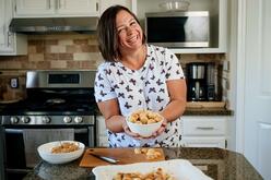 Olha holds a bowl of cookies