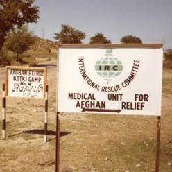 Sign for an IRC medical clinic at a refugee camp for Afghans in Pakistan, 1988.