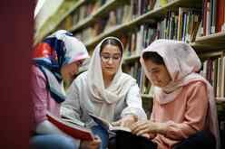 Afghan Students reading in the library.
