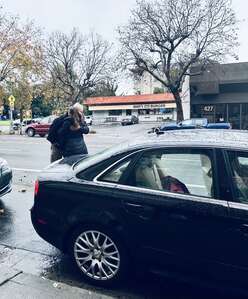 Iryna and the donor who gifted her his used car.