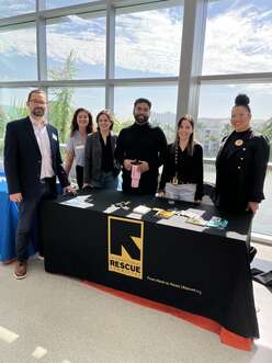 The IRC Miami teams attend an outreach event.
