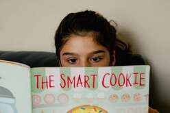 Student reads "The Smart Cookie" as part of Silver Spring's Summer Academy