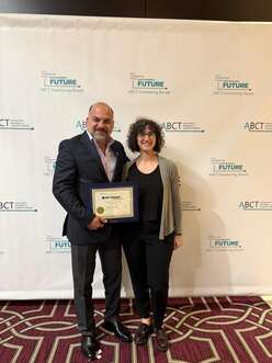 Dr. Aziz receives the award.