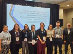 Dr. Aziz poses with convention attendees