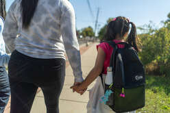 Women walking with daughter