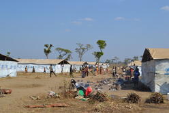 New arrivals must wait up to two weeks in these shelters, which house 150 people each, before being moved to a family tent.