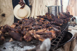 Meat cooking on the grill at Quality Restaurant. 