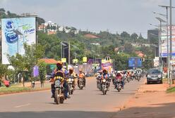 Boda Bodas—motorbike taxis—carry passengers in Kampala