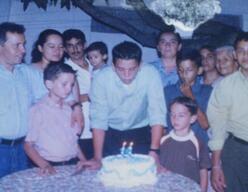 Suahmirs about to blow out the candles on his cake at a party for his 14th birthday in Honduras