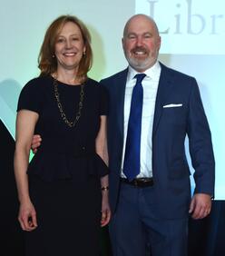 Laurel and Cliff Asness pose for a photo at a benefit event