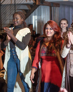 Noreen Amir walks the runway alongside models at HOPE Couture. 