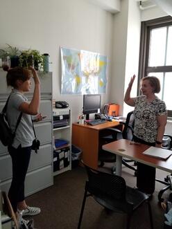 client and volunteer/staff prepping for the naturalization process in the office