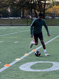 student playing soccer