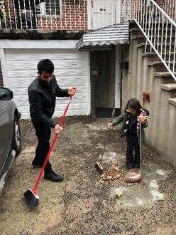 Family in front of their garage