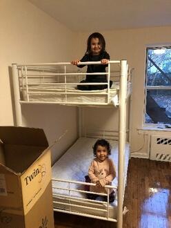 two children testing their bunk beds