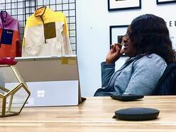 Woman sitting in a desk at the cotapaxi store.