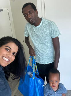 Jennica, a father and son, pose for a selfie with Ikea bag.