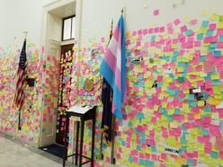 AOC office with many post-its in the hallway
