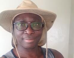 Entrepreneur with safari hat and glasses portrait.