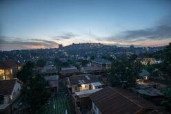 An aerial view of a hilly neighborhood in Kampala, Uganda just after sunset