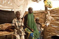 A family in their thatch home in Yola.