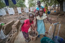 Girls fetch water at an IRC-installed pump