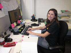 New IRC in Los Angeles Caseworker Alexandria sits at her desk