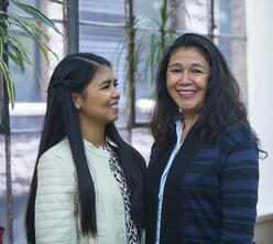 Two women posing for a picture.