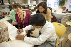 People filling out the green card aplication.