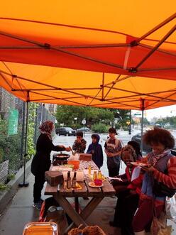 people gathered around the NRCF's Farmer's market