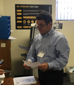 Volunteer, who moved here from Syria years ago, working at the front desk