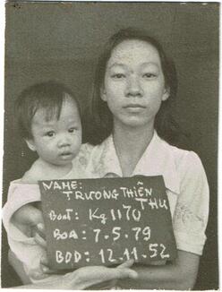 Kathy Tran at 7 months old, being held by her mother in a Malaysian refugee camp