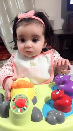 Ayla Mohamad playing with toys.