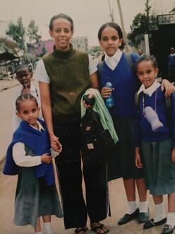 Edom and her sisters ready for school in Kenya