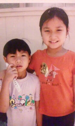 Eh Kaw and her brother in Thailand