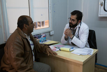 Abu Raed visits Dr. Mohammad Al-Omari at the IRC's health clinic in Zaatari refugee camp Abu Raed; an asthma patient, visits Dr. Mohammad Al-Omari at IRC's health clinic in Za'atari refugee camp. Dr. Mohammad does a check-up and gives him health advice.