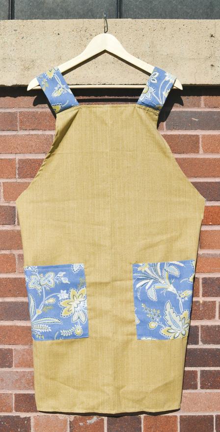 Smock apron created by Haleema and Marziye at Fancy Bridal & Alterations Smock apron created by Haleema and Marziye at Fancy Bridal & Alterations, a business developed with the help of the International Rescue Committee
